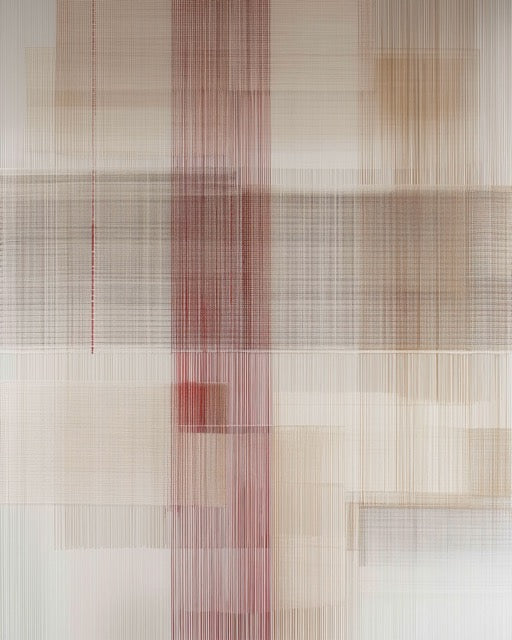 Textile art piece with grid pattern and red accents on a neutral background