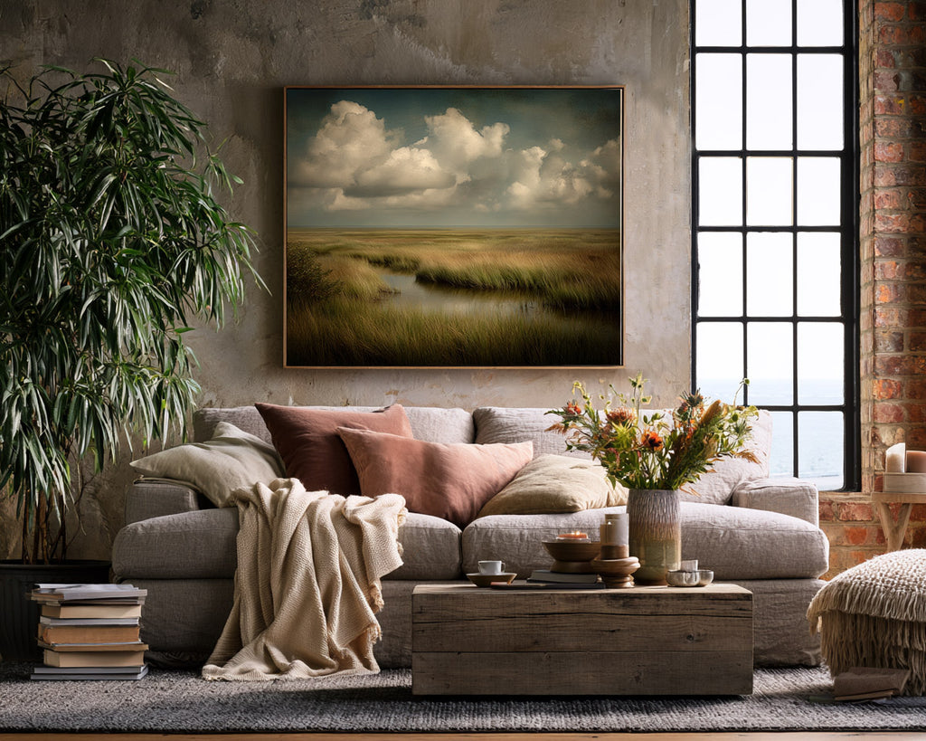 Cozy living room with a sofa, coffee table, and wall art.