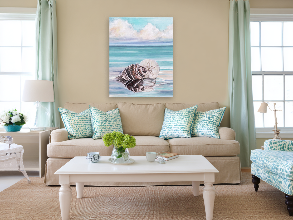 Living room with beige sofa, coffee table, and decorative pillows featuring a beach scene painting on the wall.