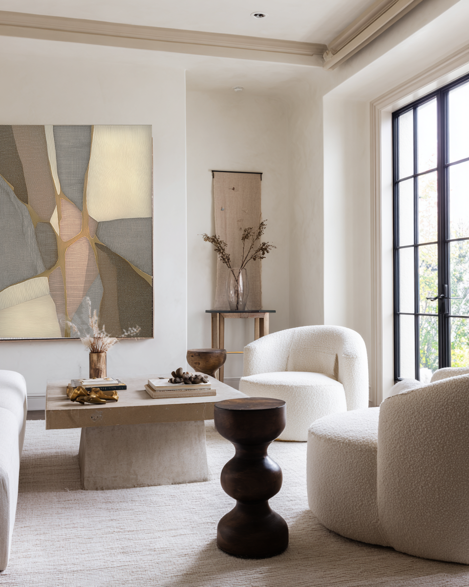 Modern living room with neutral tones, furniture, and decor.
