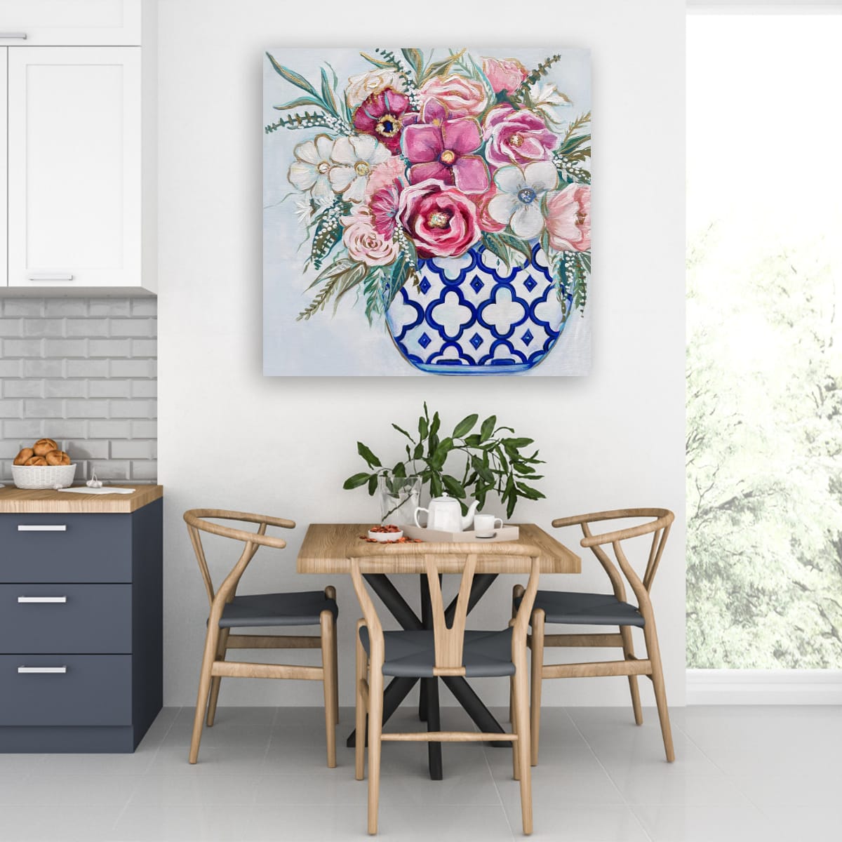 Dining area with a table and chairs, and a floral painting on the wall.