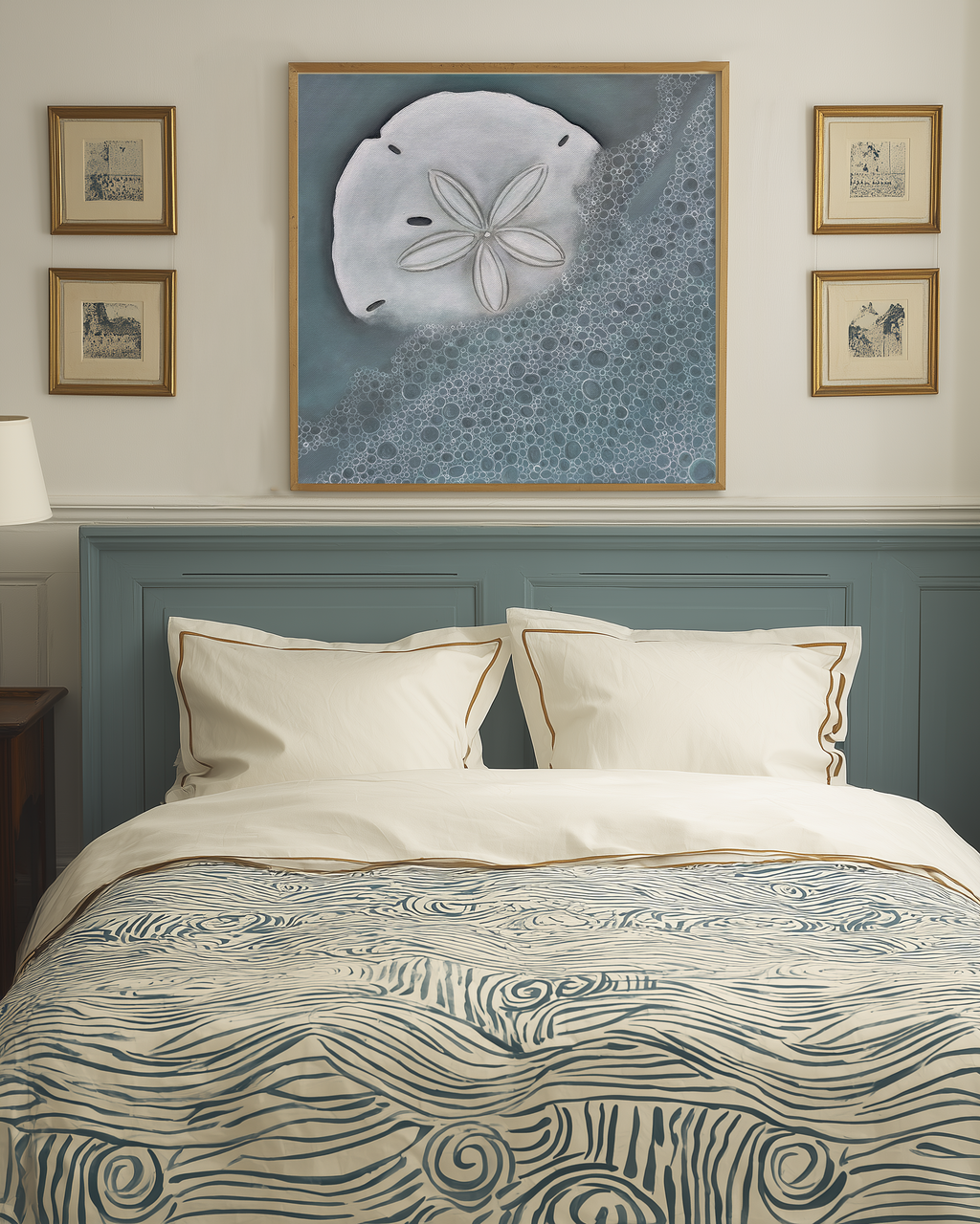 Bedroom with a bed featuring a wave-patterned comforter, framed artwork on the wall, and matching headboard.