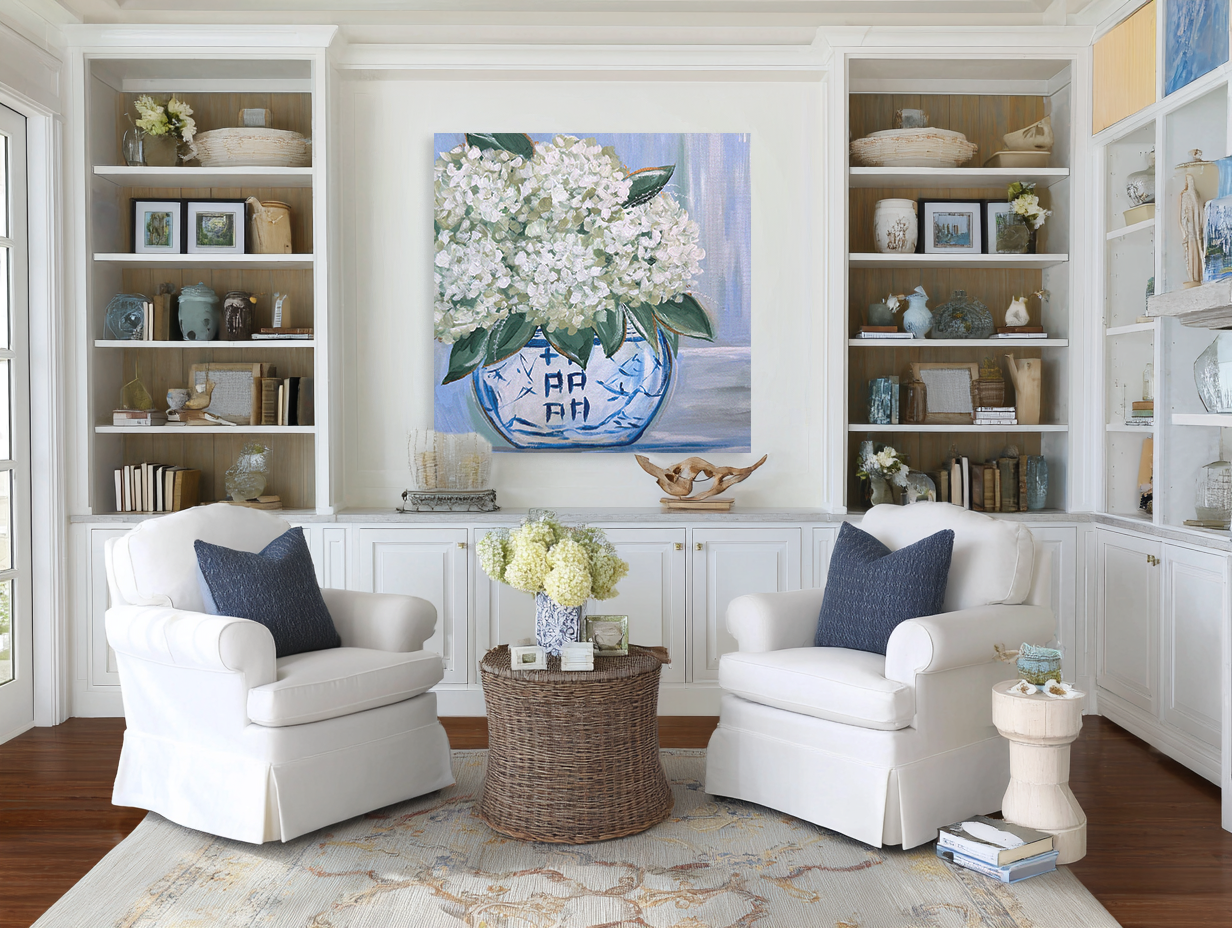 Living room with white armchairs, a coffee table, and decorative items.